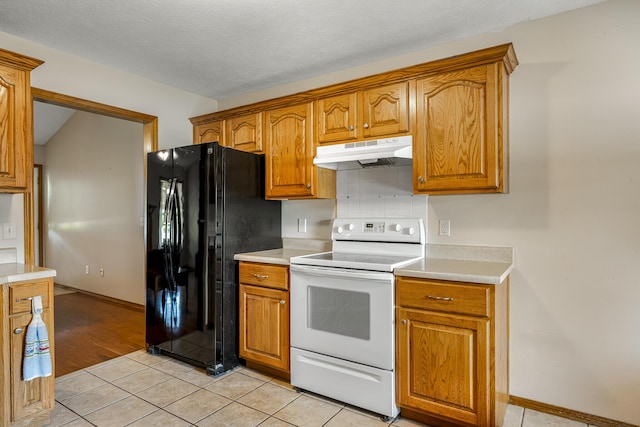 849 S Mahn Ave, Springfield, MO 65802 - kitchen featuring under cabinet range hood, white electric range oven, freestanding refrigerator, light countertops, and brown cabinets