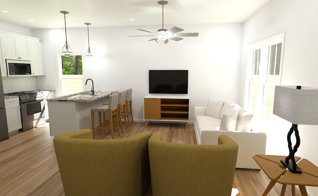 716-718 W Division St, Springfield, MO 65803 - living room featuring ceiling fan, recessed lighting, and light wood-style flooring
