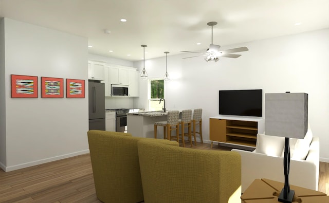 716-718 W Division St, Springfield, MO 65803 - living room with light wood-style flooring, a ceiling fan, baseboards, and recessed lighting