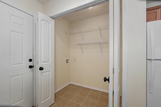 612-614 E Daniels St, Ozark, MO 65721 - washroom featuring washer hookup, light tile patterned floors, and baseboards