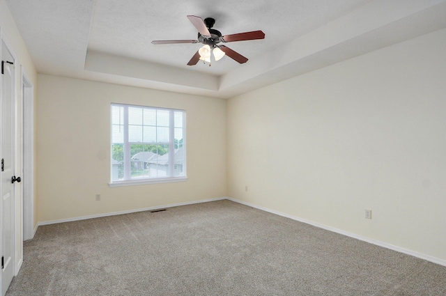 612-614 E Daniels St, Ozark, MO 65721 - unfurnished room featuring carpet, a tray ceiling, a ceiling fan, and baseboards