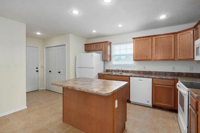612-614 E Daniels St, Ozark, MO 65721 - kitchen with white appliances, a sink, a center island, recessed lighting, and brown cabinets