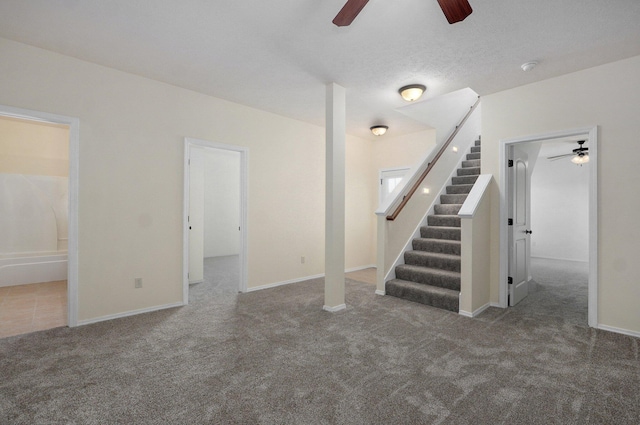 612-614 E Daniels St, Ozark, MO 65721 - unfurnished living room with ceiling fan, carpet, stairs, and baseboards