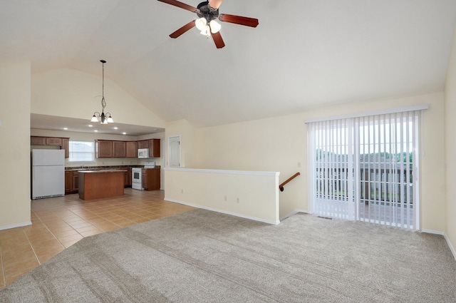 612-614 E Daniels St, Ozark, MO 65721 - unfurnished living room with a ceiling fan, baseboards, light tile patterned floors, high vaulted ceiling, and light colored carpet