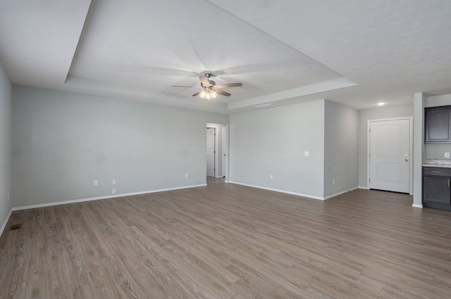 1366 S Olde Savannah Ave, Republic, MO 65738 - spare room featuring a raised ceiling, baseboards, and a ceiling fan