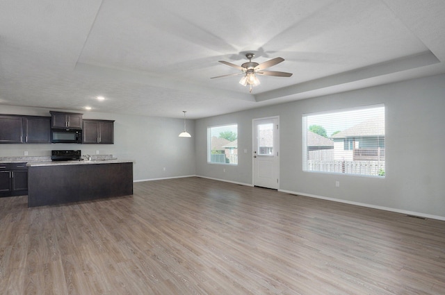 1366 S Olde Savannah Ave, Republic, MO 65738 - kitchen featuring black microwave, baseboards, ceiling fan, range, and light countertops