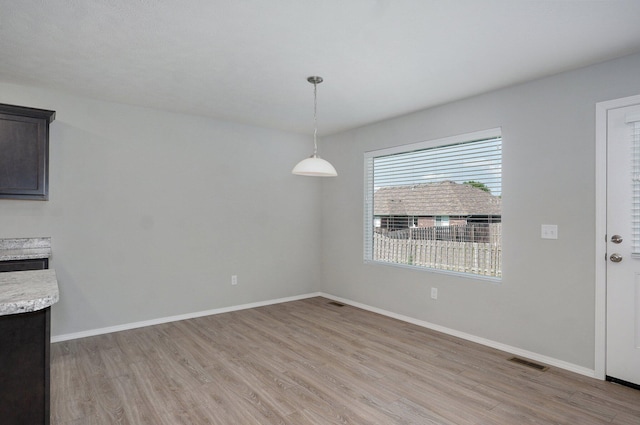 1366 S Olde Savannah Ave, Republic, MO 65738 - unfurnished dining area with light wood-style flooring and baseboards