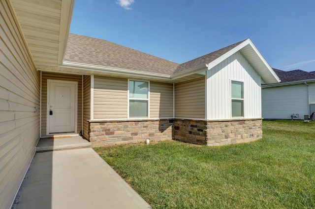 1366 S Olde Savannah Ave, Republic, MO 65738 - entrance to property featuring a shingled roof, a yard, board and batten siding, and stone siding