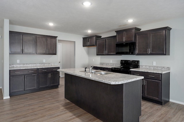 1366 S Olde Savannah Ave, Republic, MO 65738 - kitchen with black appliances, wood finished floors, a sink, light countertops, and recessed lighting