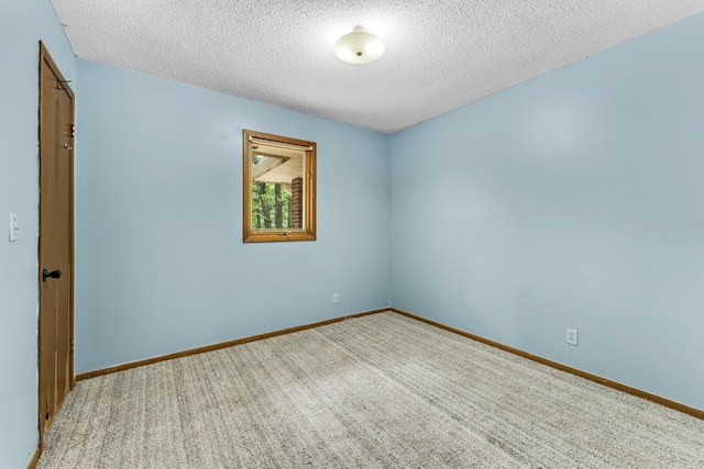 1061 Brentwood Dr, Marshfield, MO 65706 - unfurnished room with a textured ceiling, carpet, and baseboards