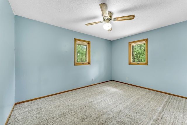 1061 Brentwood Dr, Marshfield, MO 65706 - empty room featuring healthy amount of natural light, ceiling fan, a textured ceiling, carpet floors, and baseboards