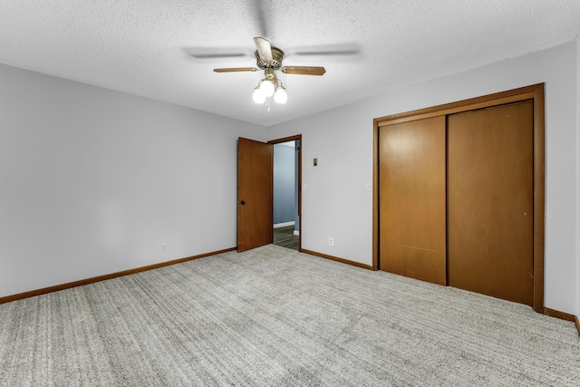 1061 Brentwood Dr, Marshfield, MO 65706 - unfurnished bedroom featuring a closet, carpet floors, baseboards, a textured ceiling, and ceiling fan