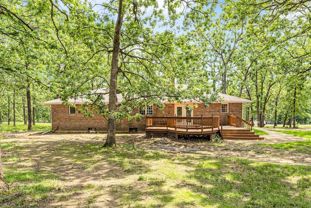 1061 Brentwood Dr, Marshfield, MO 65706 - back of property with a wooden deck and brick siding