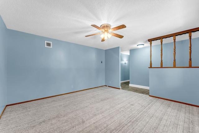 1061 Brentwood Dr, Marshfield, MO 65706 - carpeted empty room featuring a ceiling fan, a textured ceiling, and baseboards