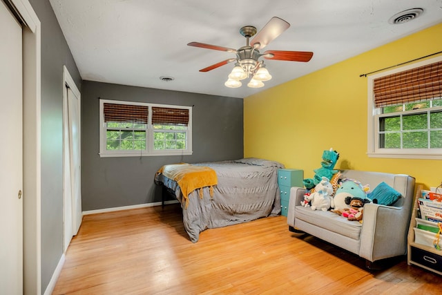 2215 E Rosebrier St, Springfield, MO 65804 - bedroom with wood finished floors, a closet, and ceiling fan