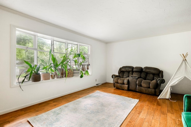 2215 E Rosebrier St, Springfield, MO 65804 - living area featuring ornamental molding and hardwood / wood-style floors