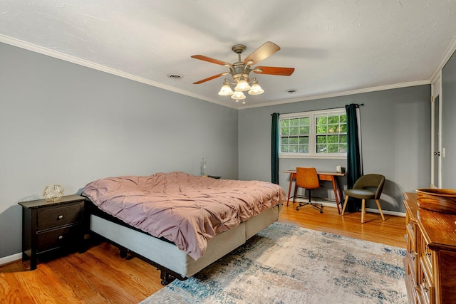 2215 E Rosebrier St, Springfield, MO 65804 - bedroom featuring wood finished floors, crown molding, and a ceiling fan