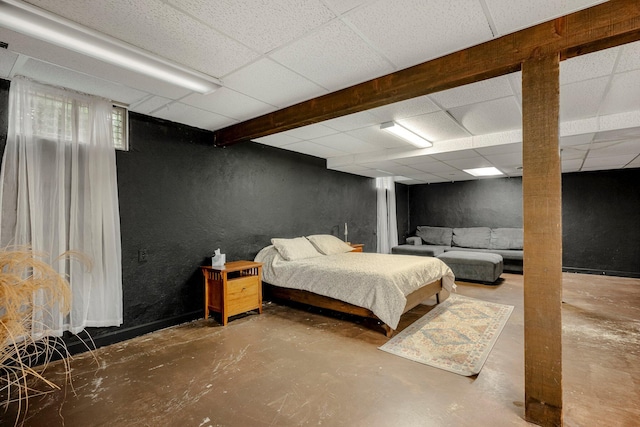 2215 E Rosebrier St, Springfield, MO 65804 - bedroom featuring a textured wall, finished concrete floors, and a paneled ceiling