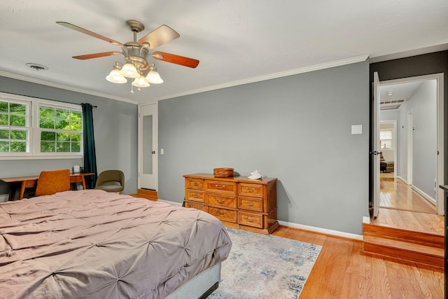 2215 E Rosebrier St, Springfield, MO 65804 - bedroom with light wood-style flooring, crown molding, and a ceiling fan