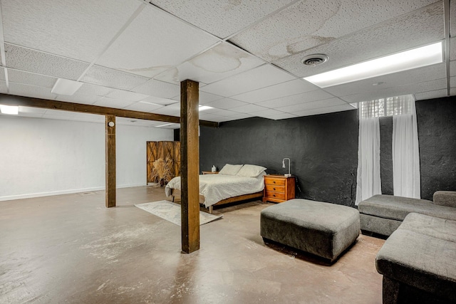 2215 E Rosebrier St, Springfield, MO 65804 - bedroom featuring a drop ceiling, finished concrete flooring, and a textured wall