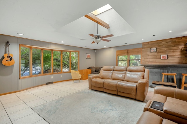 2215 E Rosebrier St, Springfield, MO 65804 - living area with tile patterned flooring, plenty of natural light, a skylight, recessed lighting, and a ceiling fan