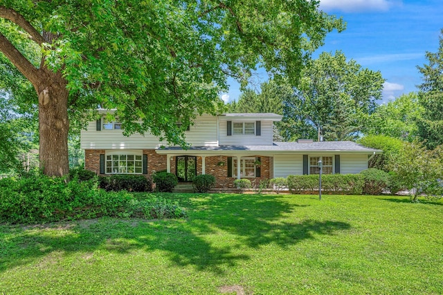 2215 E Rosebrier St, Springfield, MO 65804 - traditional-style house with a front yard and brick siding