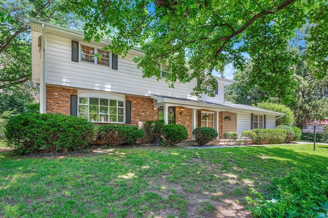 2215 E Rosebrier St, Springfield, MO 65804 - view of front of house featuring a front lawn, brick siding, and a porch