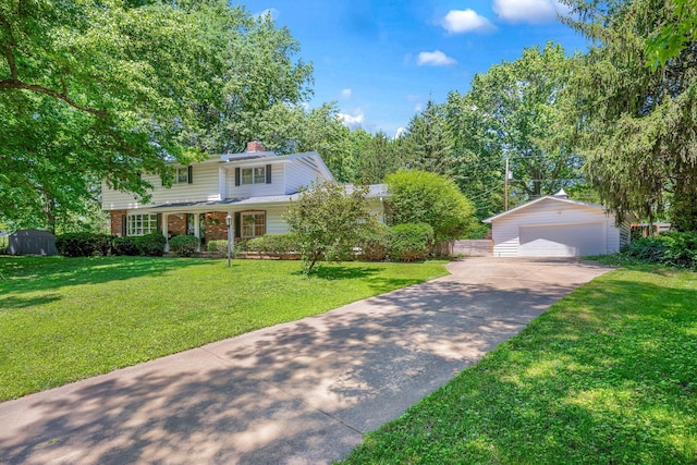 2215 E Rosebrier St, Springfield, MO 65804 - traditional-style house featuring an outbuilding, a detached garage, brick siding, a chimney, and a front yard