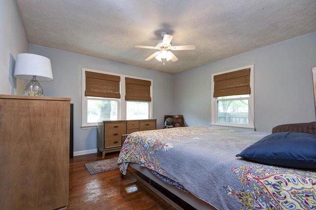 2344 E Manchester St, Springfield, MO 65804 - bedroom with dark wood finished floors, baseboards, and ceiling fan