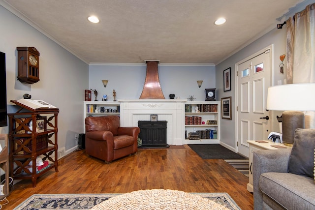 2344 E Manchester St, Springfield, MO 65804 - living area featuring a fireplace, wood finished floors, baseboards, crown molding, and recessed lighting