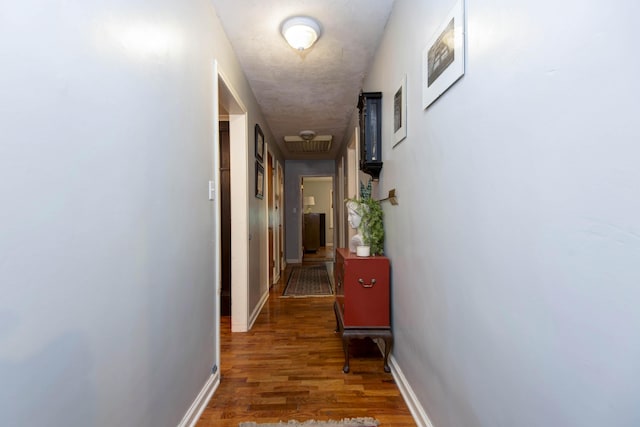 2344 E Manchester St, Springfield, MO 65804 - corridor with wood finished floors, baseboards, attic access, and a textured ceiling