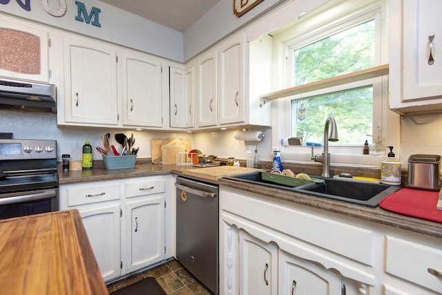 2344 E Manchester St, Springfield, MO 65804 - kitchen with stainless steel dishwasher, a sink, range with electric stovetop, and white cabinetry