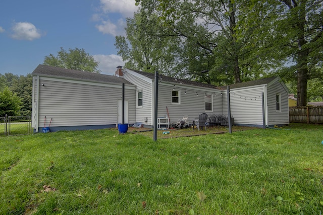 2344 E Manchester St, Springfield, MO 65804 - rear view of property with a chimney