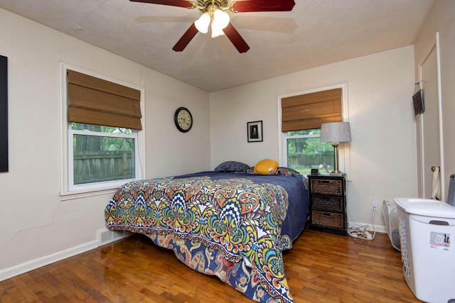 2344 E Manchester St, Springfield, MO 65804 - bedroom featuring wood finished floors, multiple windows, and baseboards