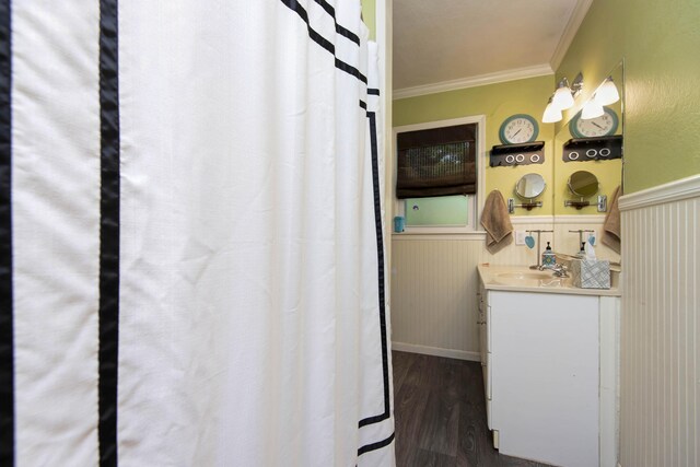 2344 E Manchester St, Springfield, MO 65804 - full bathroom featuring crown molding, wood finished floors, vanity, and a wainscoted wall