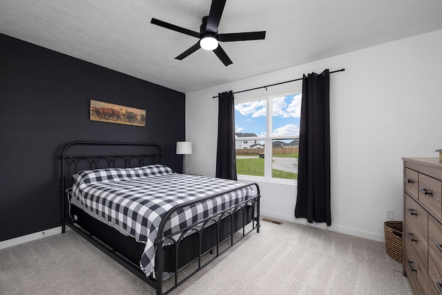 1118 E Lakota St, Nixa, MO 65714 - bedroom with light carpet, baseboards, and a ceiling fan