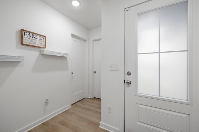 1118 E Lakota St, Nixa, MO 65714 - doorway with light wood-type flooring, baseboards, and recessed lighting