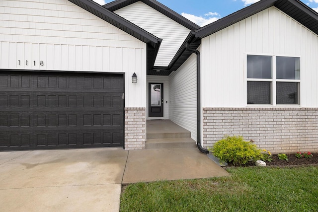 1118 E Lakota St, Nixa, MO 65714 - view of front facade with brick siding, a garage, and concrete driveway