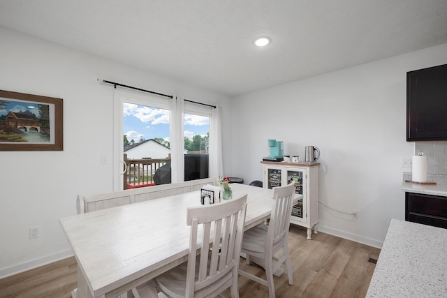 1118 E Lakota St, Nixa, MO 65714 - dining space with light wood-type flooring, baseboards, and recessed lighting
