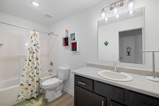 1118 E Lakota St, Nixa, MO 65714 - bathroom with shower / bath combo, toilet, vanity, wood finished floors, and baseboards