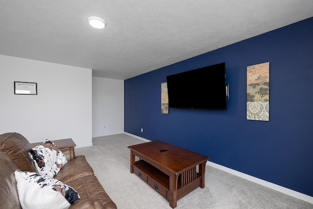 1118 E Lakota St, Nixa, MO 65714 - carpeted living area featuring a textured ceiling and baseboards