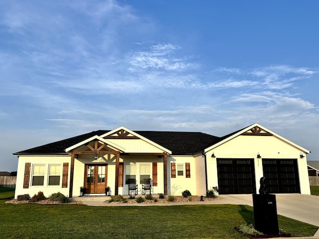 2702 Town Dr, Mountain Grove, MO 65711 - view of front of property with concrete driveway, a front lawn, french doors, a garage, and a shingled roof