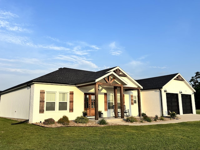 2702 Town Dr, Mountain Grove, MO 65711 - view of front of property featuring a front yard, french doors, driveway, a garage, and brick siding