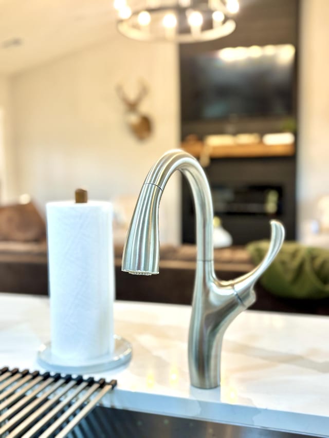 2702 Town Dr, Mountain Grove, MO 65711 - detailed view of a sink and a chandelier