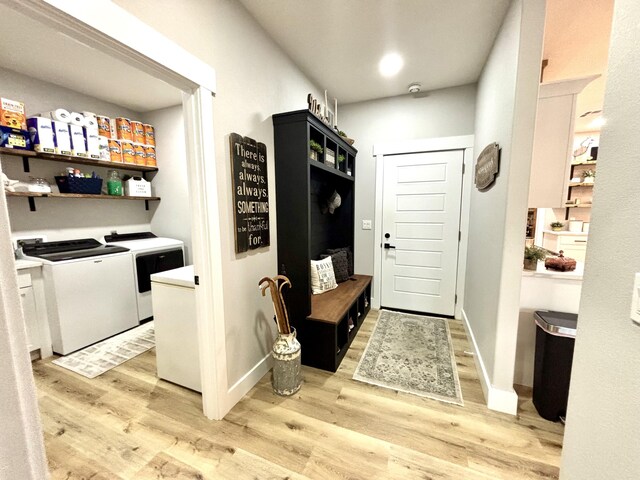 2702 Town Dr, Mountain Grove, MO 65711 - laundry room featuring washing machine and dryer, light wood-style floors, and baseboards