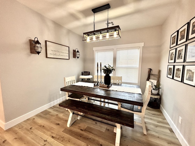 2702 Town Dr, Mountain Grove, MO 65711 - dining space with baseboards and light wood-type flooring