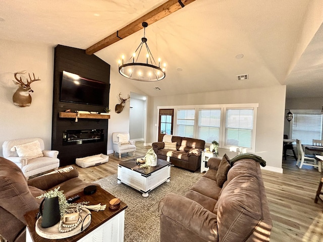 2702 Town Dr, Mountain Grove, MO 65711 - living area featuring a chandelier, wood finished floors, and baseboards
