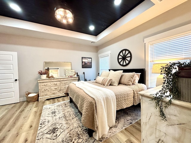 2702 Town Dr, Mountain Grove, MO 65711 - bedroom featuring wood finished floors, a tray ceiling, baseboards, and recessed lighting