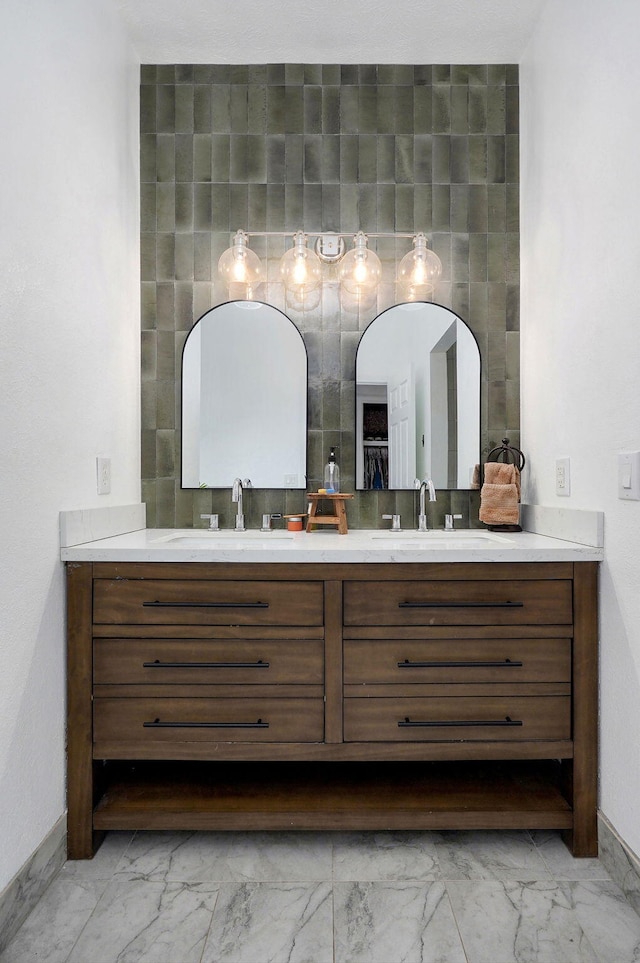 11976 N Northern Hts Dr, Brighton, MO 65617 - full bathroom with marble look tiles, double vanity, and baseboards