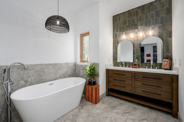 11976 N Northern Hts Dr, Brighton, MO 65617 - bathroom featuring tile walls, marble finish flooring, double vanity, and a freestanding bath
